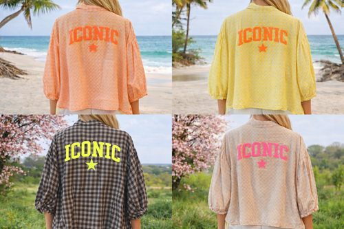 Chemisier oversize taille unique.manches 3/4 avec inscription ICONIC au dos et petite étoile devant